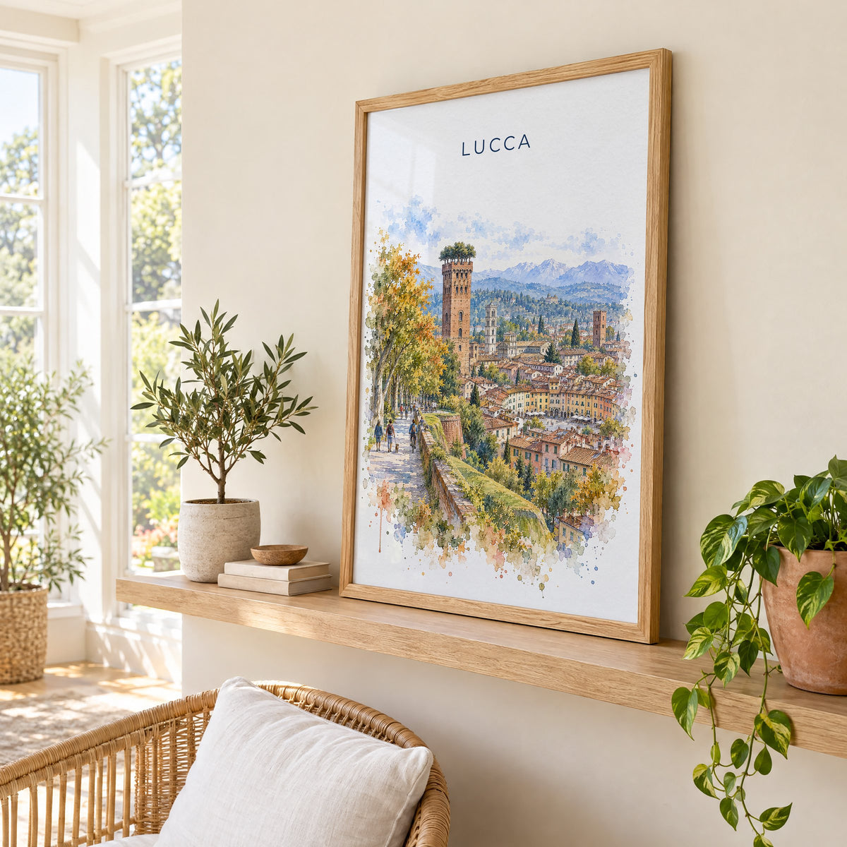 Lucca watercolor print in an oak frame on a picture ledge in a sunlit sunroom