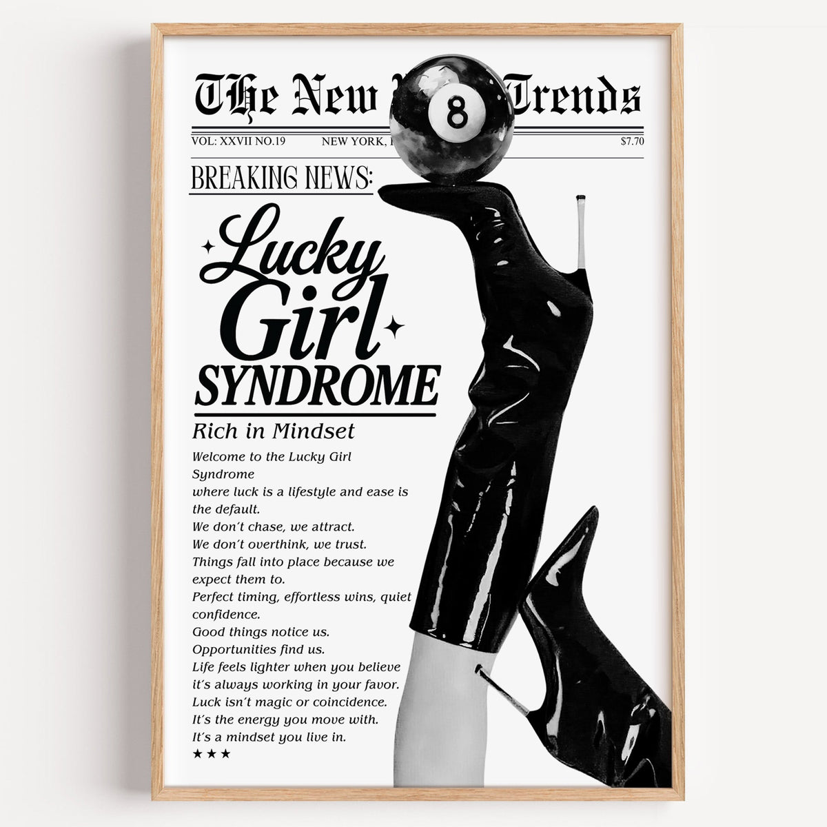 Lucky Girl Syndrome mock newspaper with boots print in a light oak frame on a plain white wall