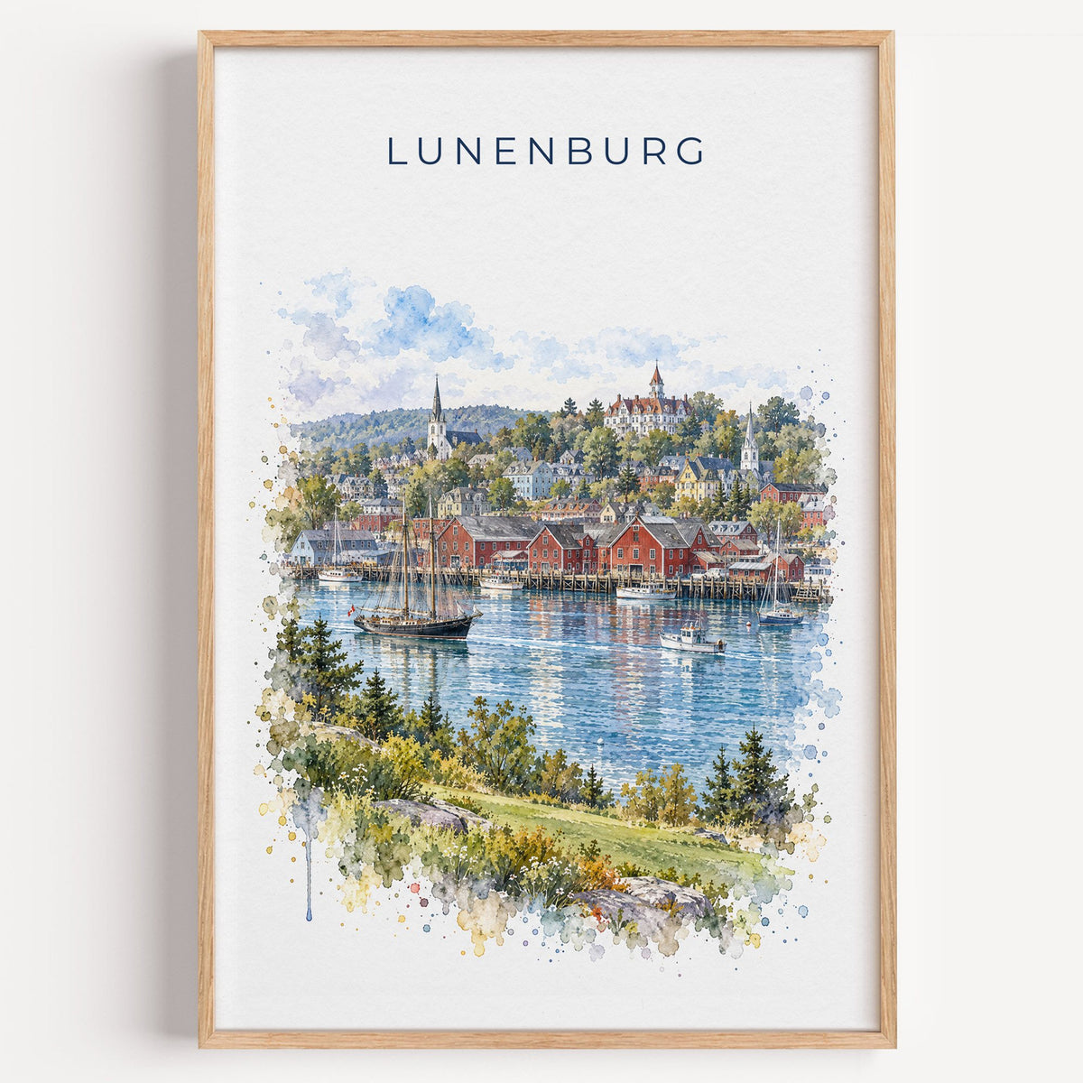 Lunenburg watercolor print in a light oak frame on a plain white wall