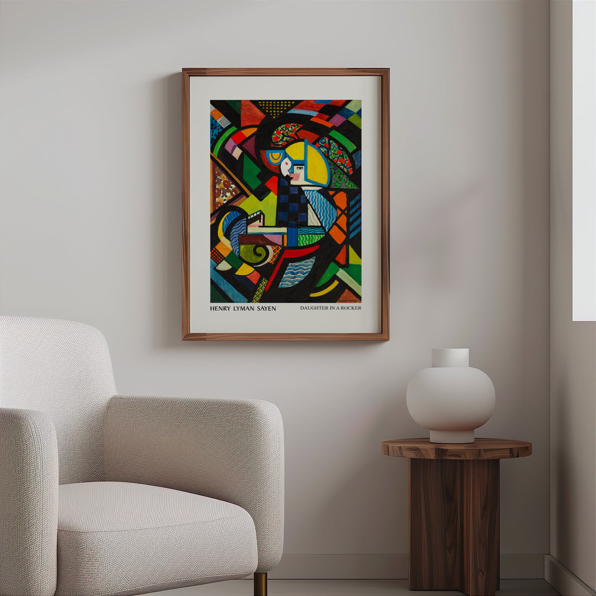 Colourful modern art print in a slim walnut frame above a bouclé armchair