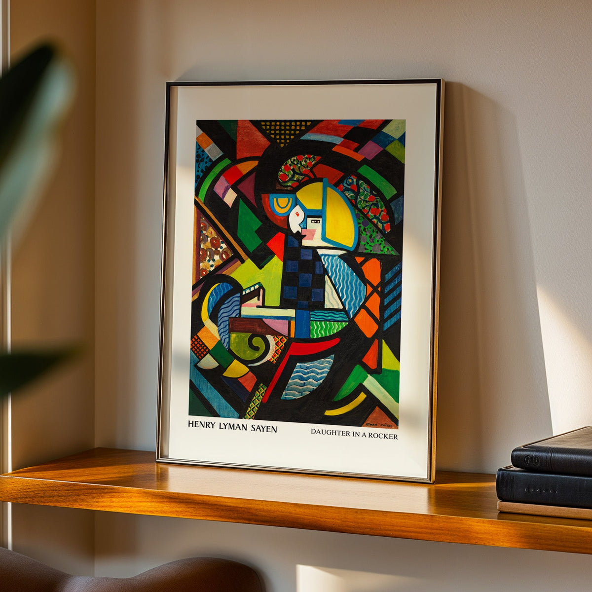 Daughter in a Rocker print in a black frame on a walnut shelf in evening light