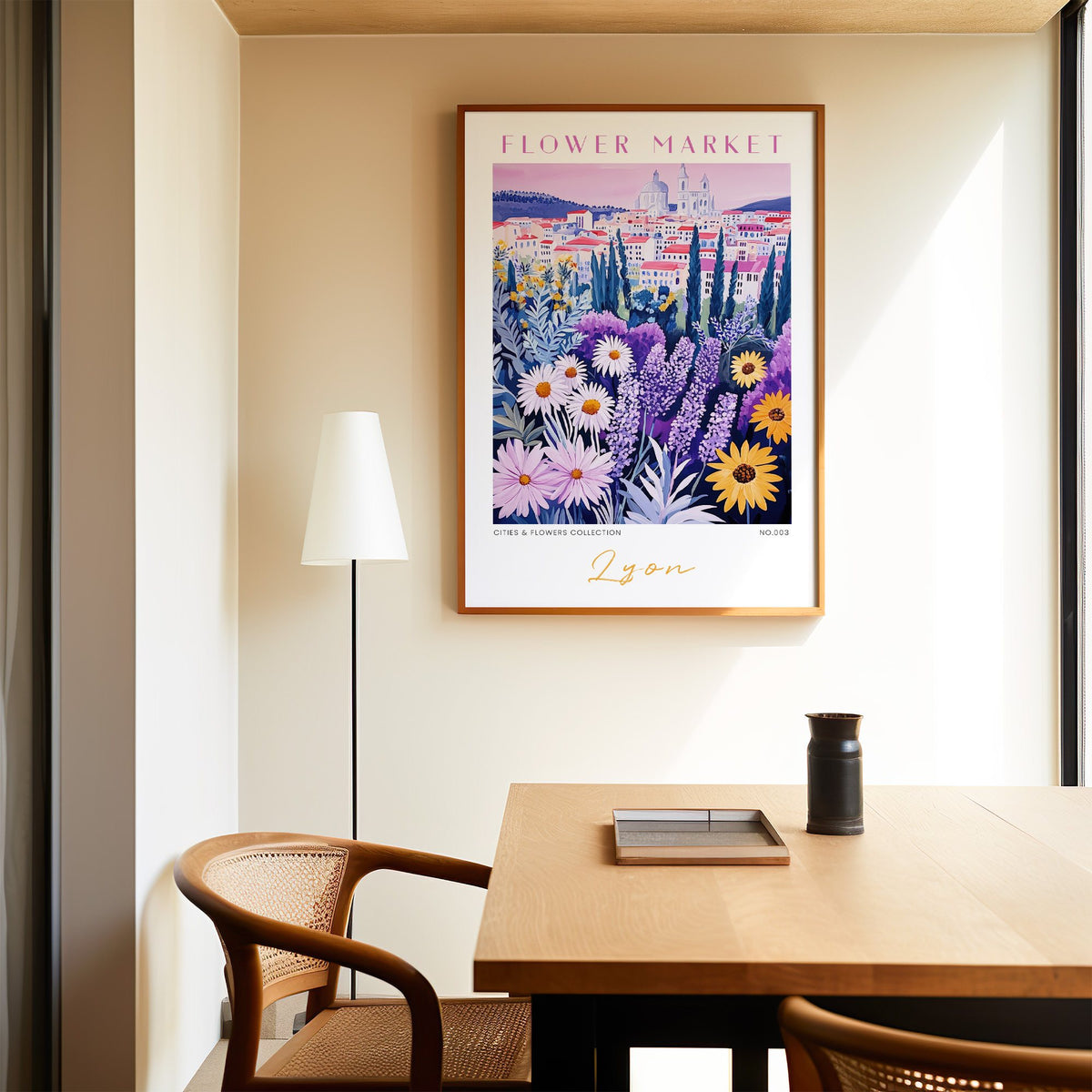 Lyon flower market print in an oak frame above a dining table and cane chair