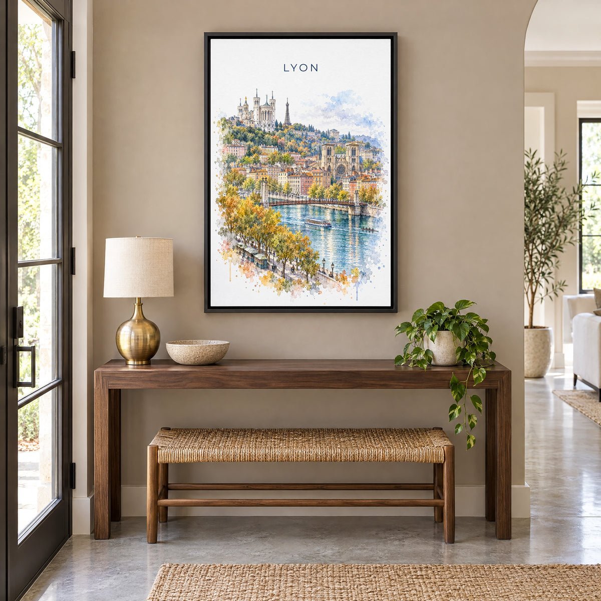 Lyon watercolor print as a black floater canvas above a walnut console and woven bench in an entryway