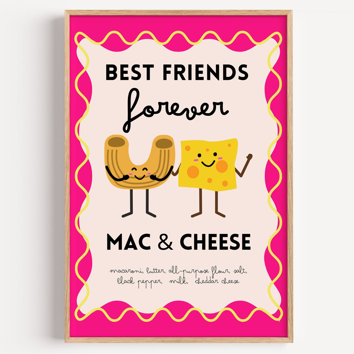 Mac and cheese best friends pink print in a light oak frame on a plain white wall