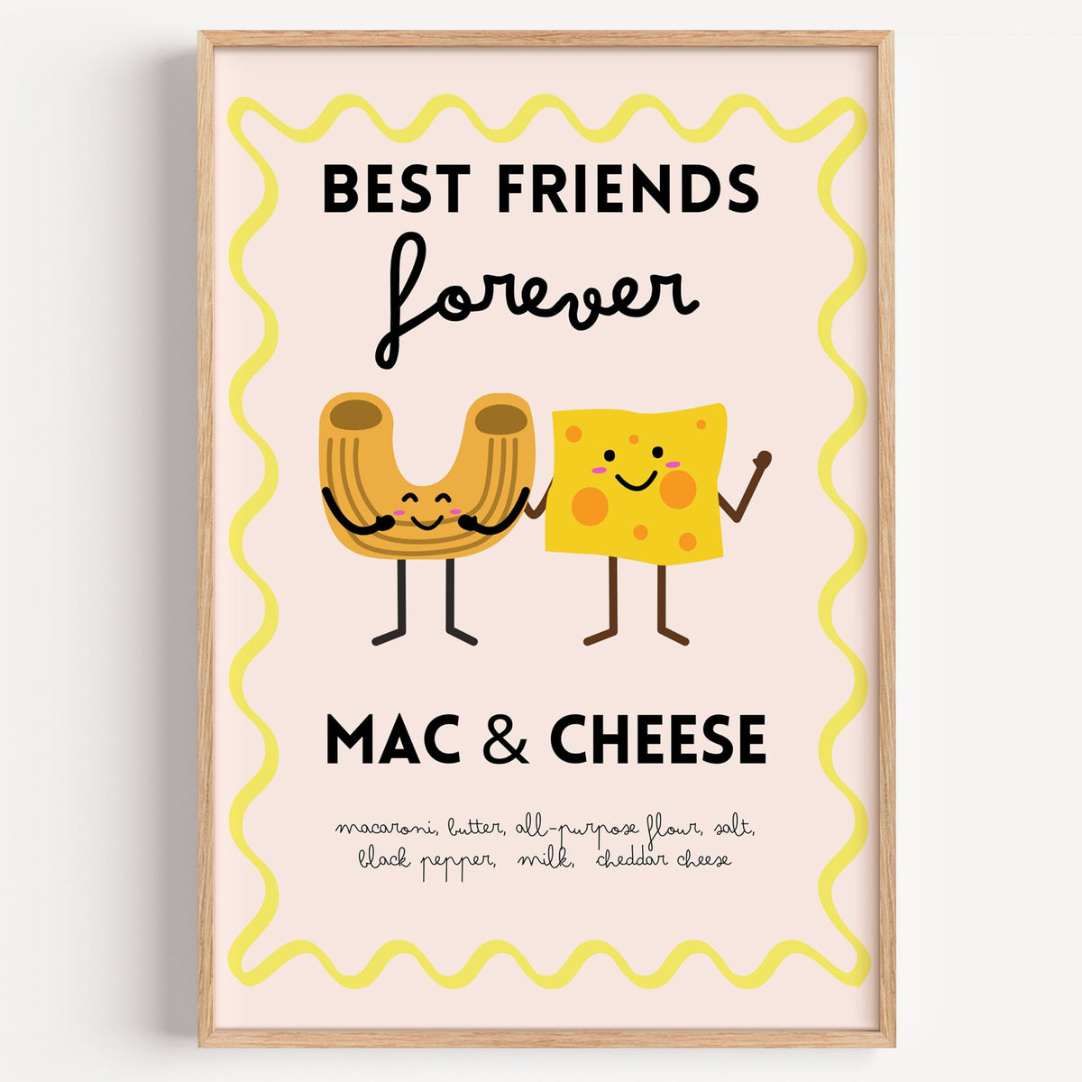 Mac and cheese best friends yellow print in a light oak frame on a plain white wall