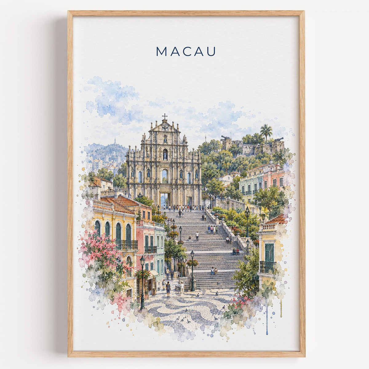 Macau watercolor print in a light oak frame on a plain white wall