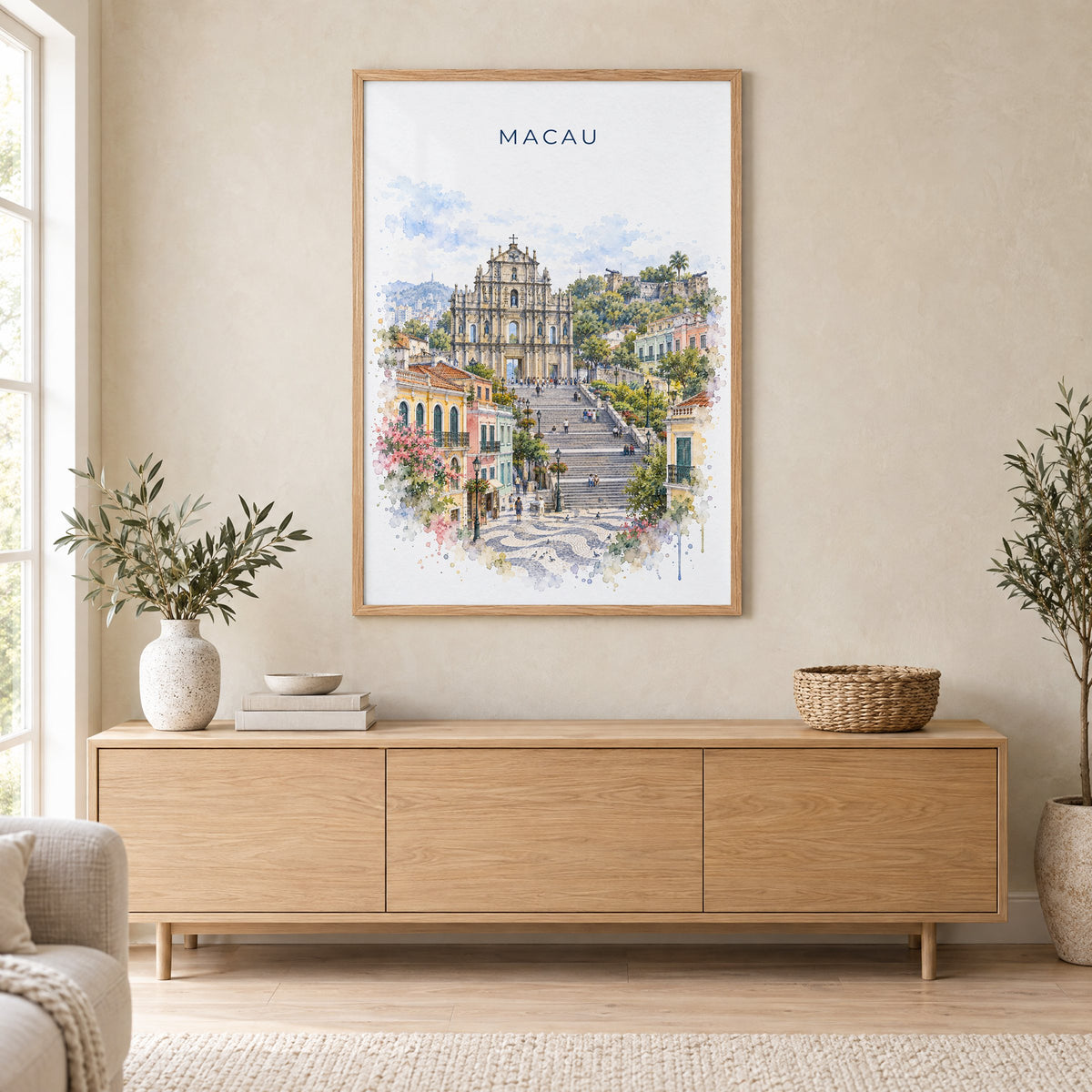 Macau watercolor print in an oak frame above a light wood sideboard in a Scandinavian living room
