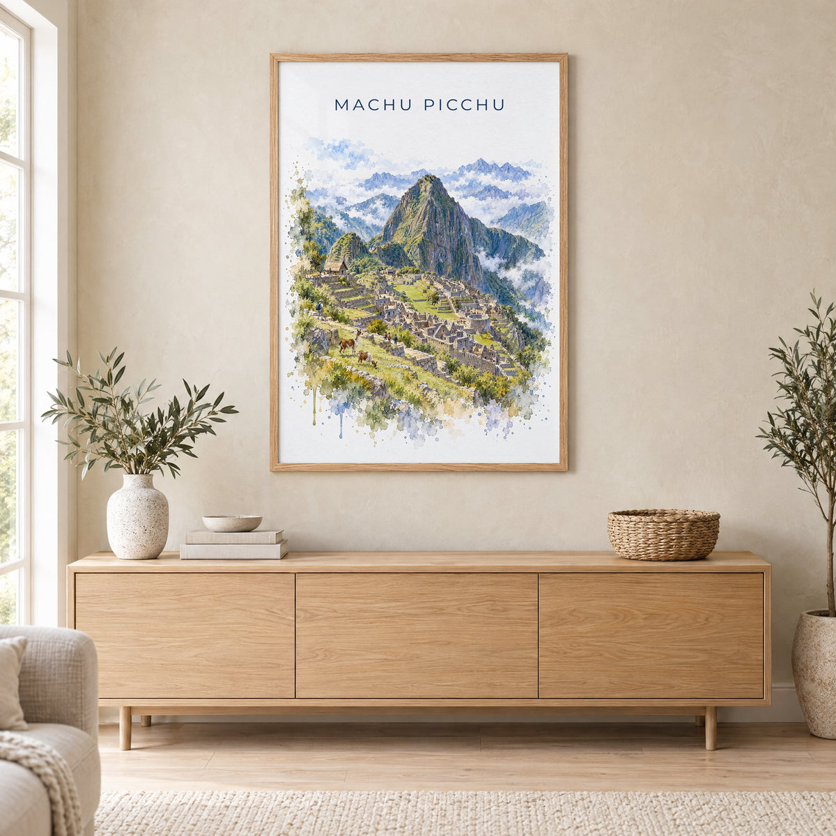 Machu Picchu watercolor print in an oak frame above a light wood sideboard in a Scandinavian living room