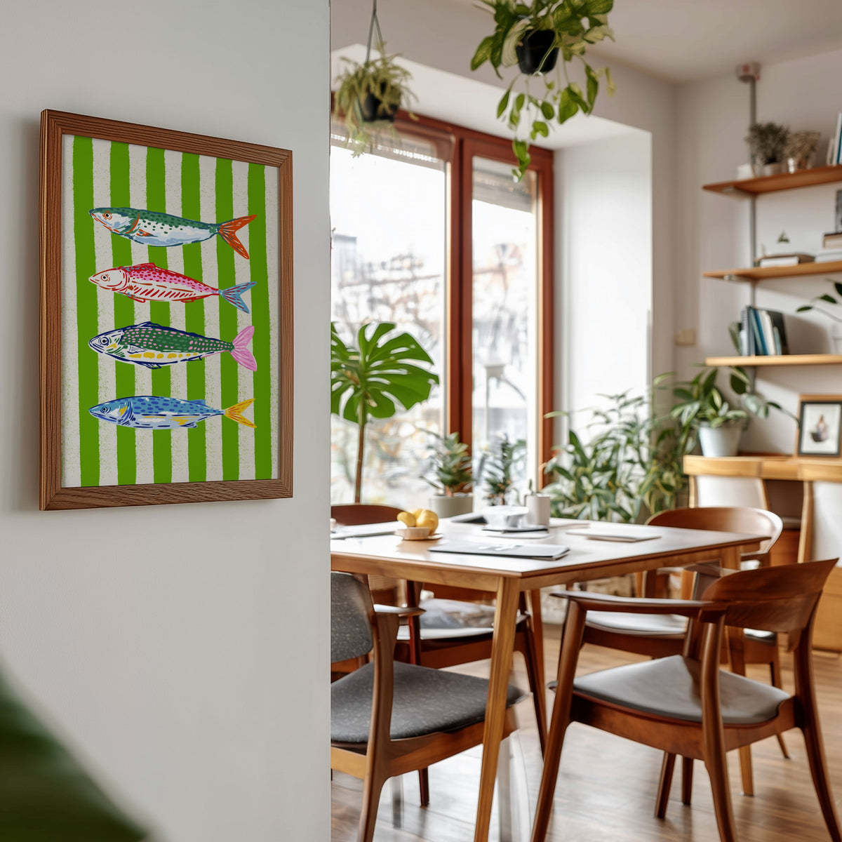 Mackerel row print in a walnut frame beside a mid-century dining table
