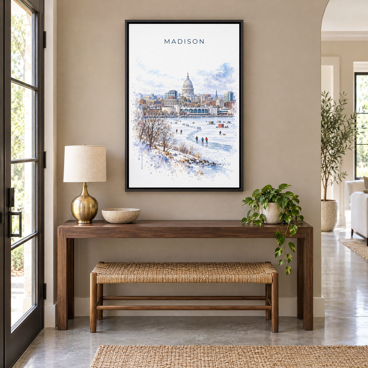 Madison watercolor print as a black floater canvas above a walnut console and woven bench in an entryway