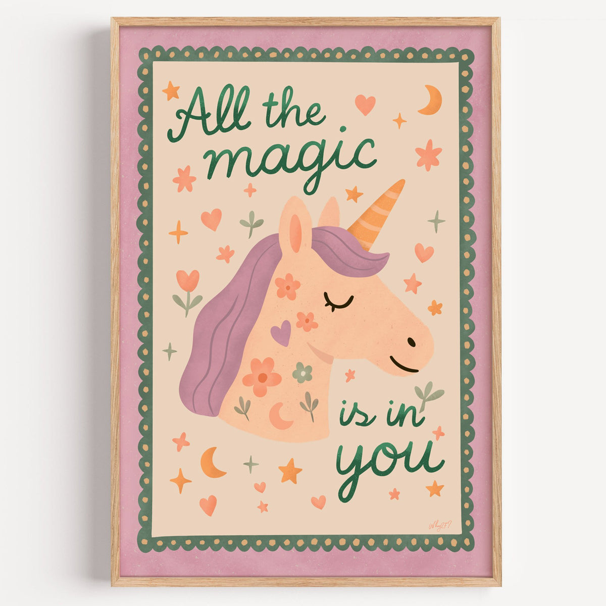Magic is in you unicorn nursery print in a light oak frame on a plain white wall