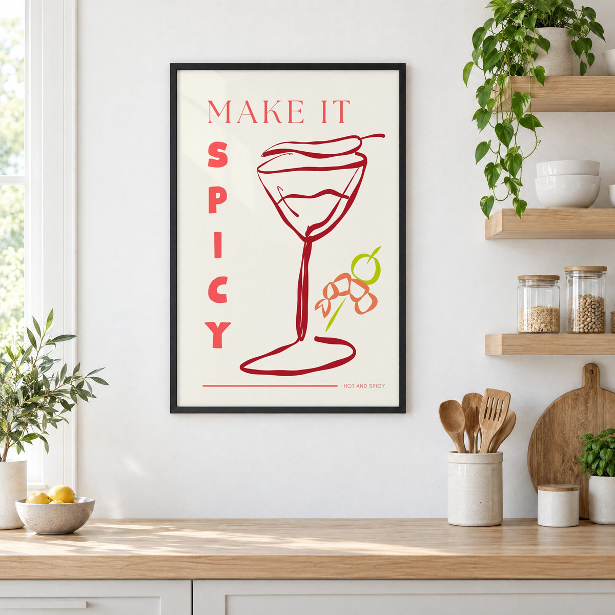 Make It Spicy martini line art print in a black frame in a white kitchen beside open wood shelves and glass jars