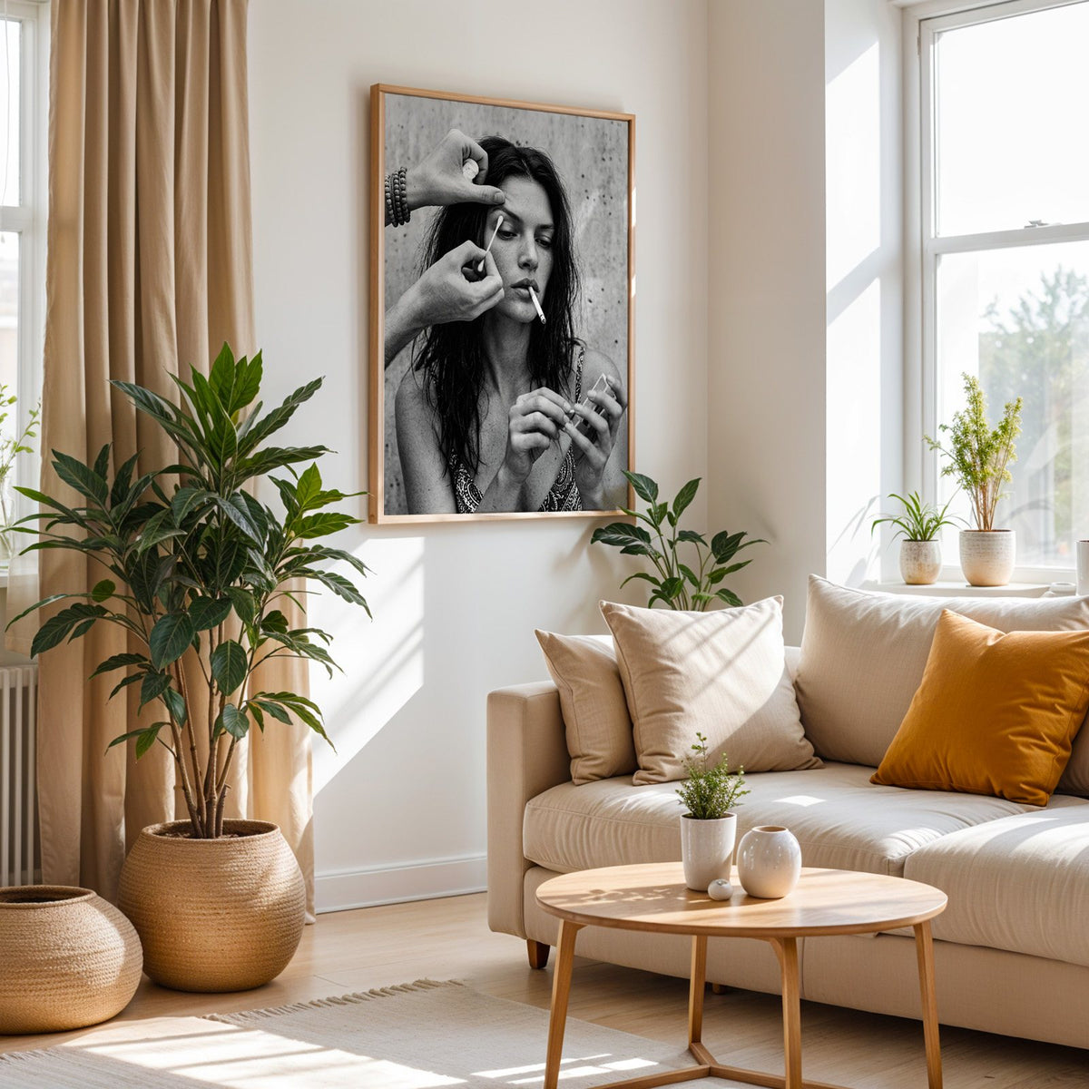 Makeup artist hands with cotton swab at eye print in an oak frame above a cream sofa beside woven planters