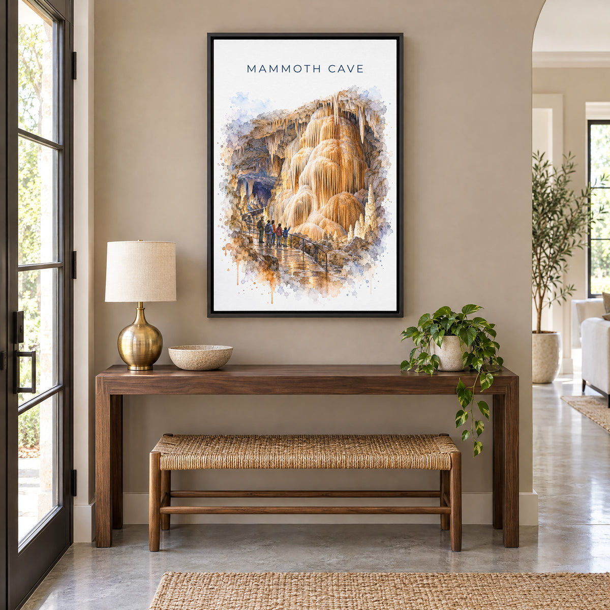 Mammoth Cave National Park watercolor print as a black floater canvas above a walnut console and woven bench in an entryway