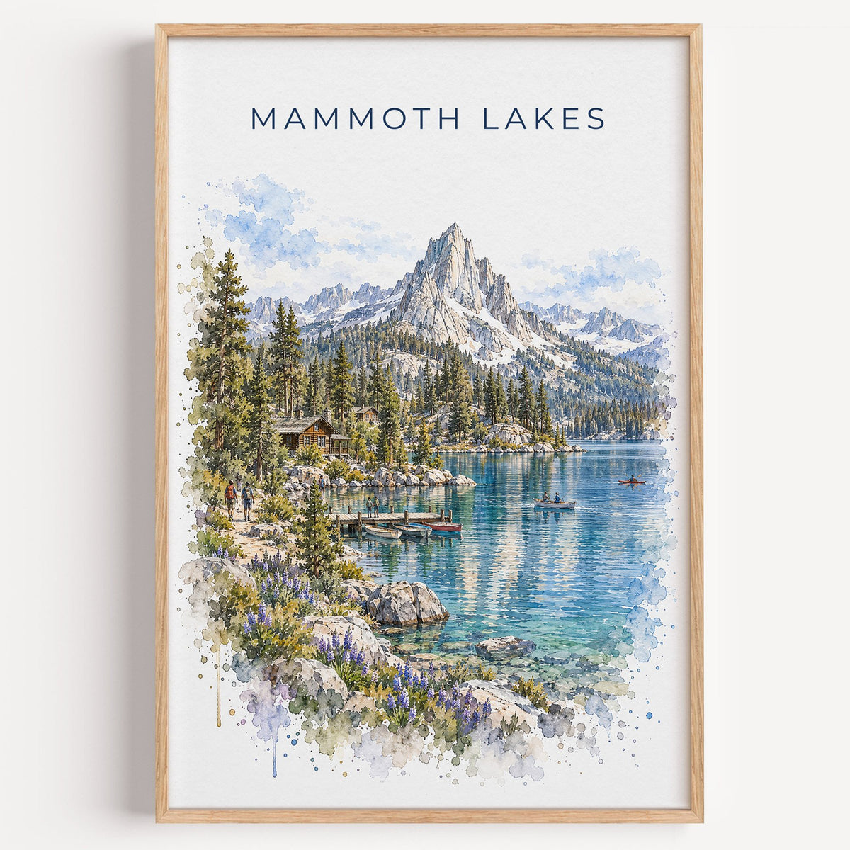 Mammoth Lakes watercolor print in a light oak frame on a plain white wall