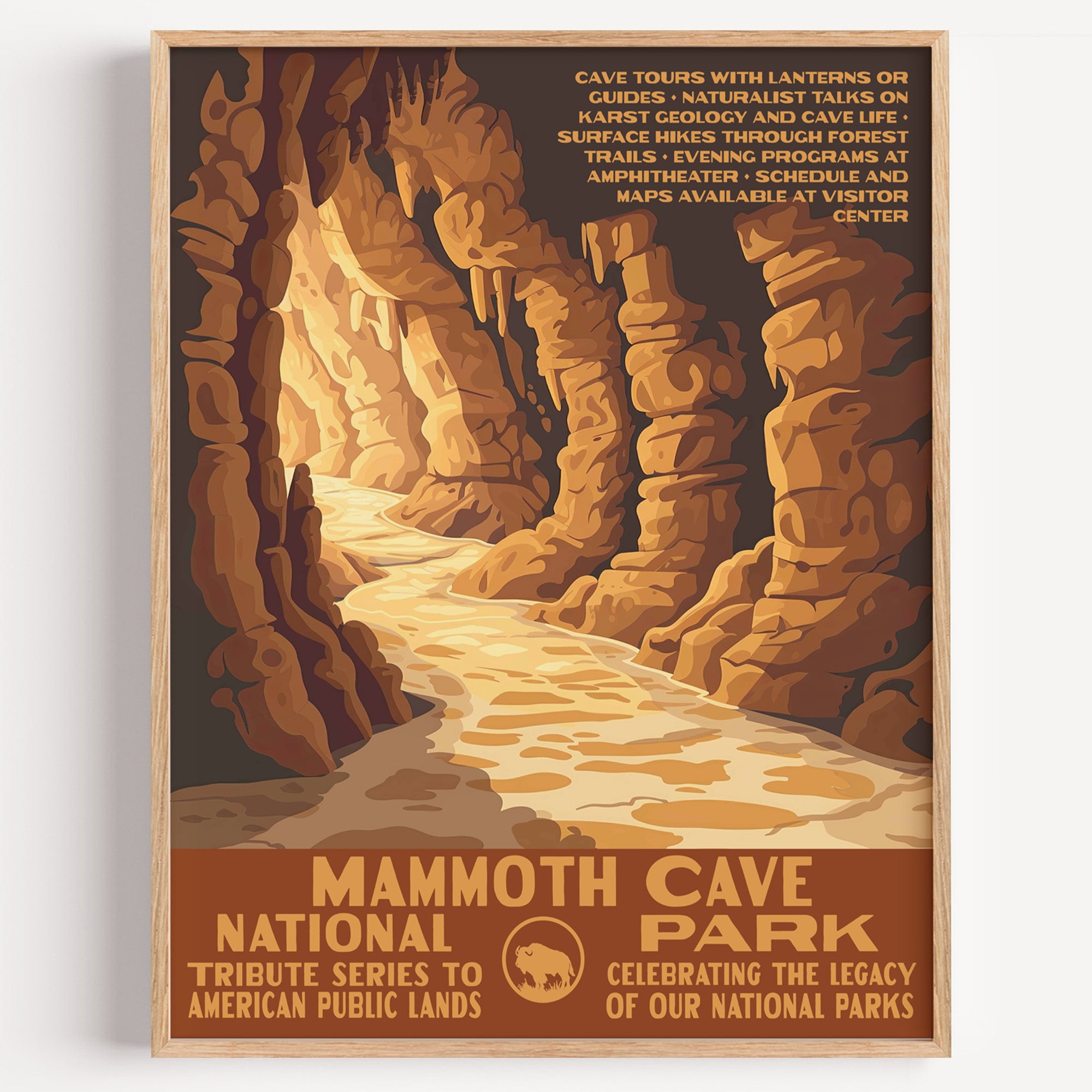 Mammoth Cave National Park wall art print in a thin wood frame, a lantern-lit passage winding deep through the cave