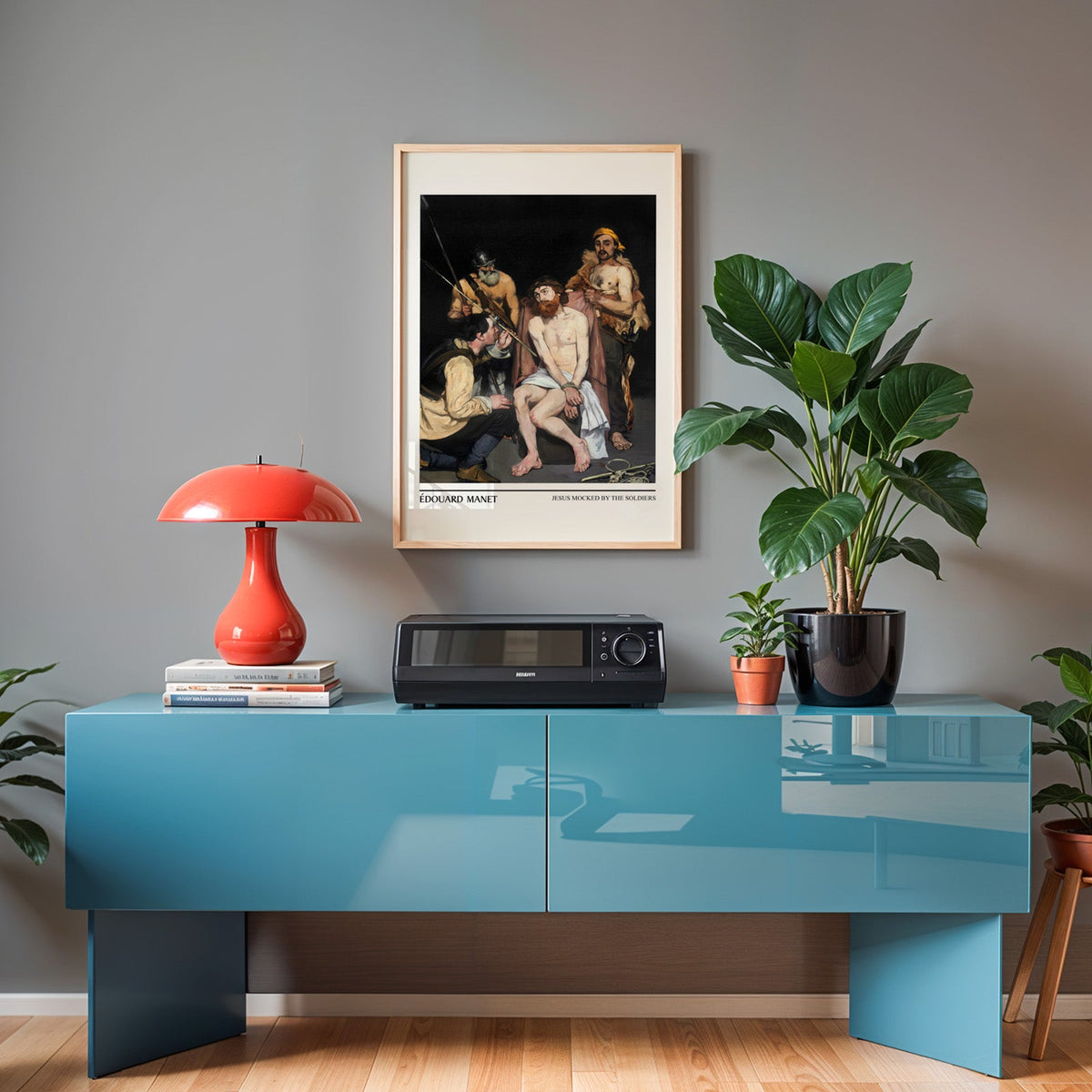 Manet print in an oak frame above a teal sideboard with a red lamp