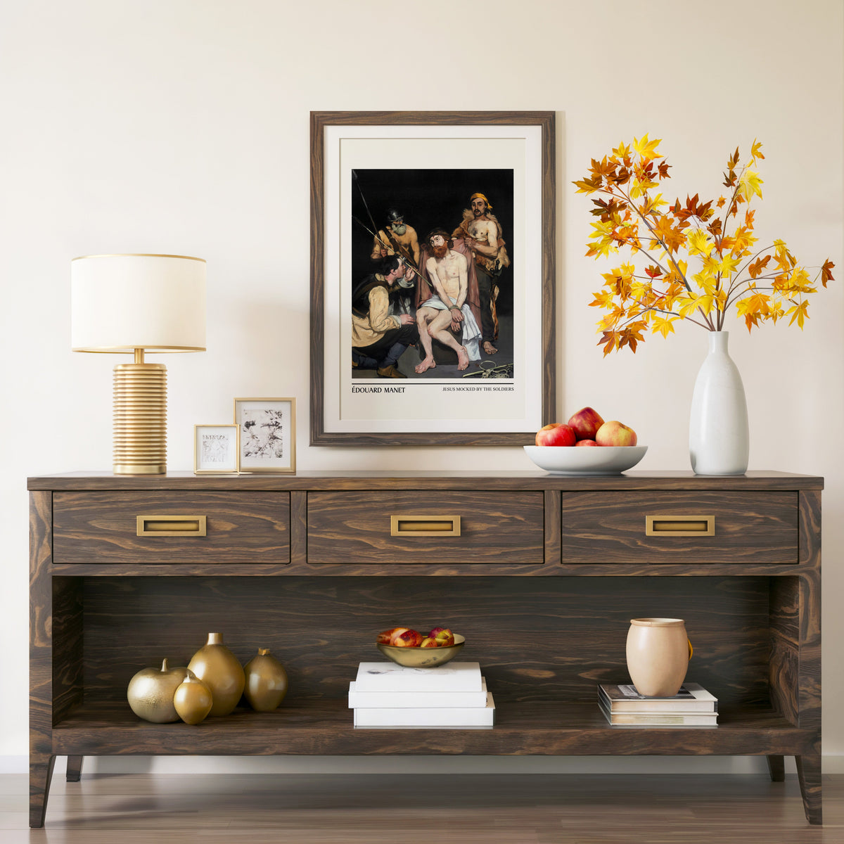 Jesus Mocked by the Soldiers print in a walnut frame above a console with autumn branches
