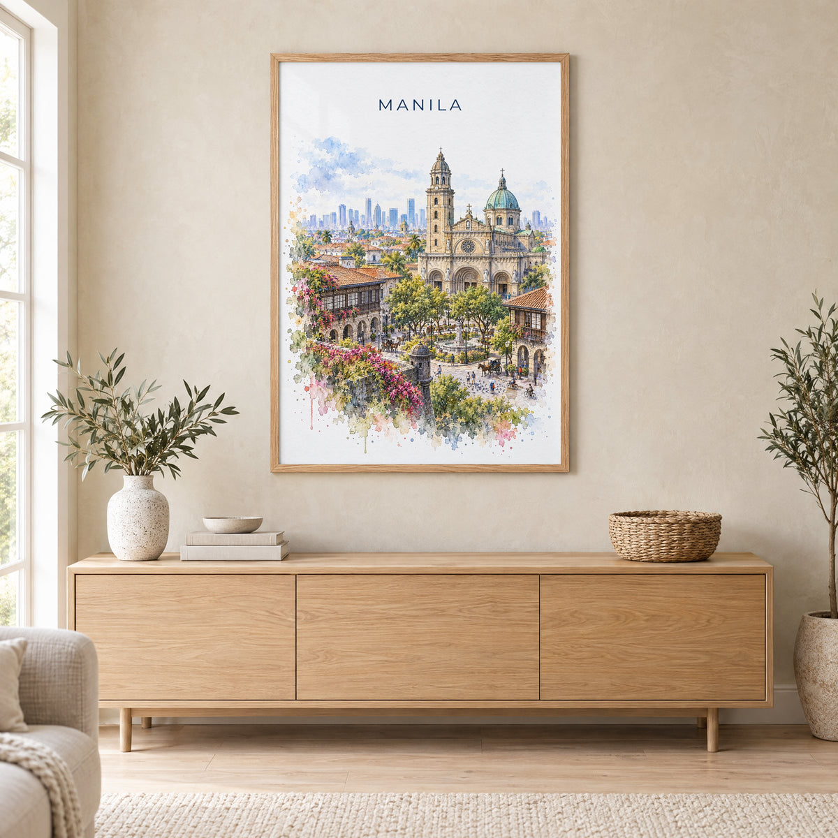 Manila watercolor print in an oak frame above a light wood sideboard in a Scandinavian living room