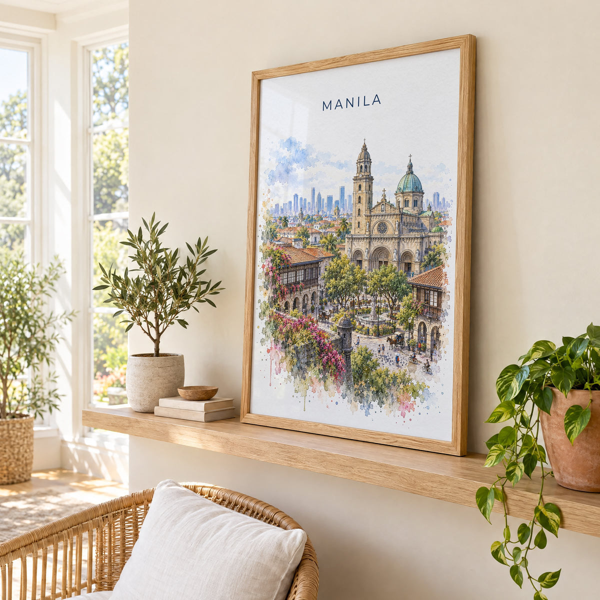 Manila watercolor print in an oak frame on a picture ledge in a sunlit sunroom