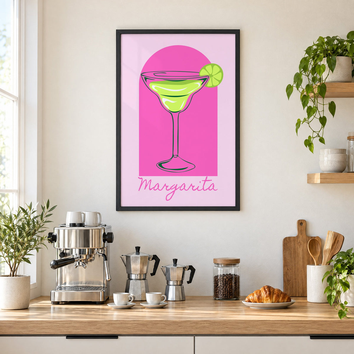 Margarita glass and lime pink arch print in a black frame above a home espresso bar with moka pots and espresso cups