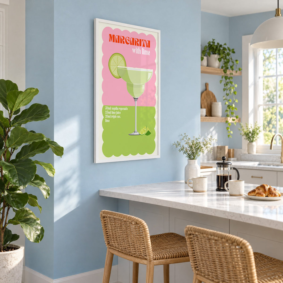 Margarita with lime scalloped print in a white frame on a pale blue wall above a breakfast bar with rattan stools