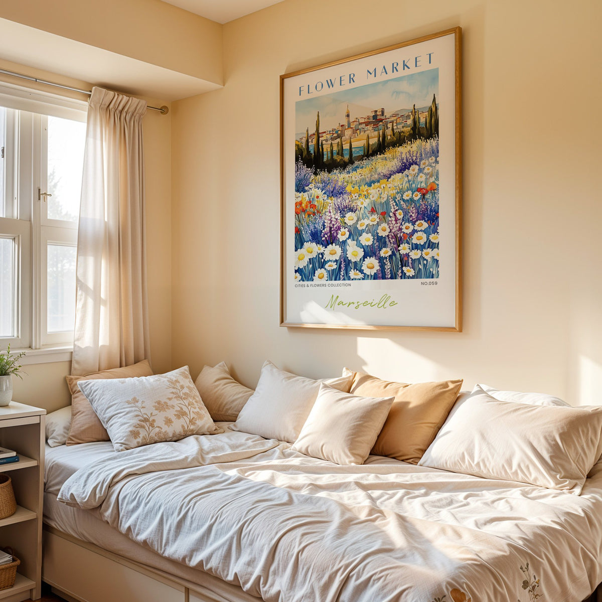 Marseille flower market print in an oak frame above a cream daybed in a sunny bedroom