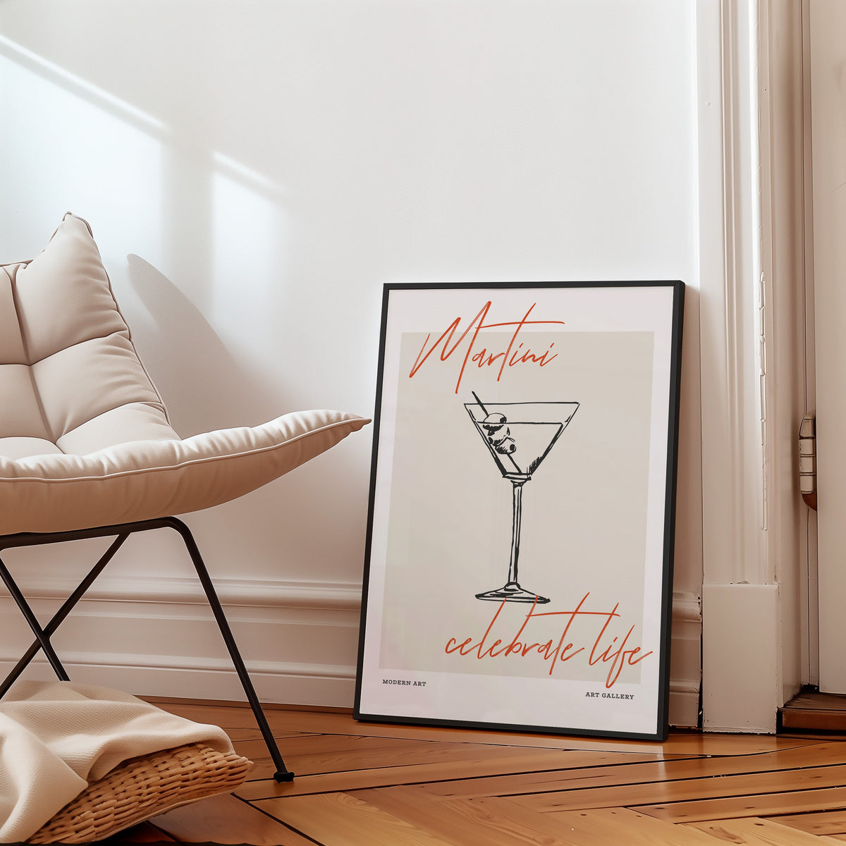 Martini Celebrate Life print in a black frame on a parquet floor