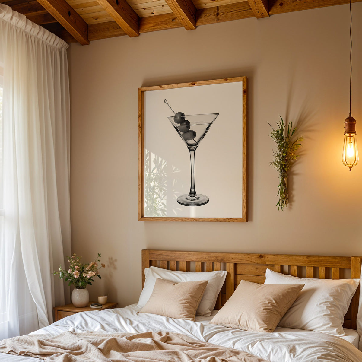 Martini glass with three olives on white print in a pine frame above a wood headboard bed under a pendant bulb