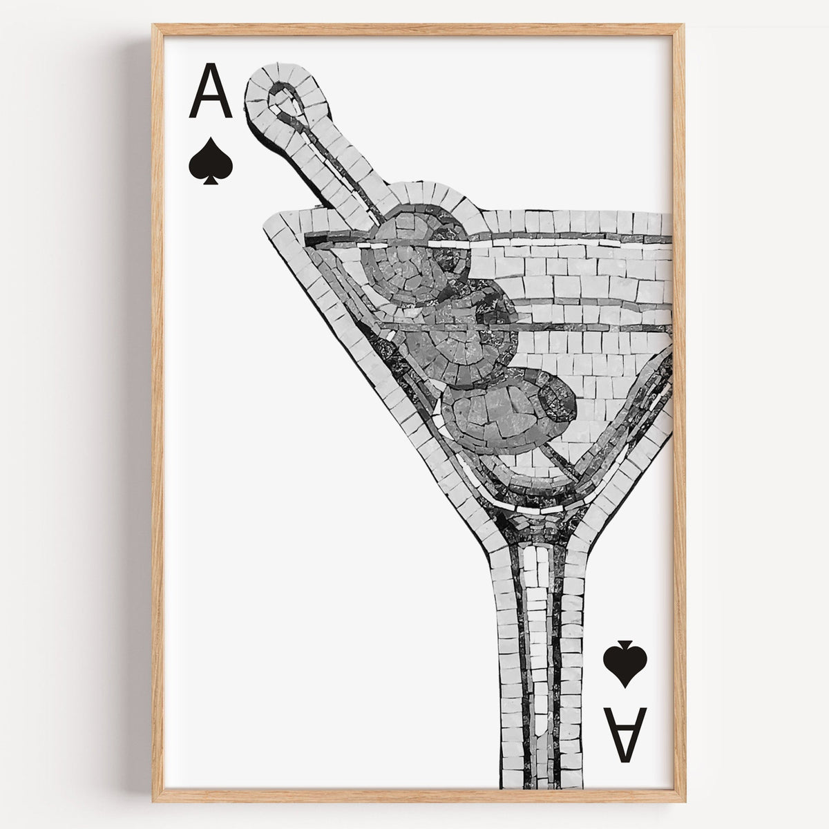Mosaic martini glass on an ace of spades card print in a light oak frame on a plain white wall