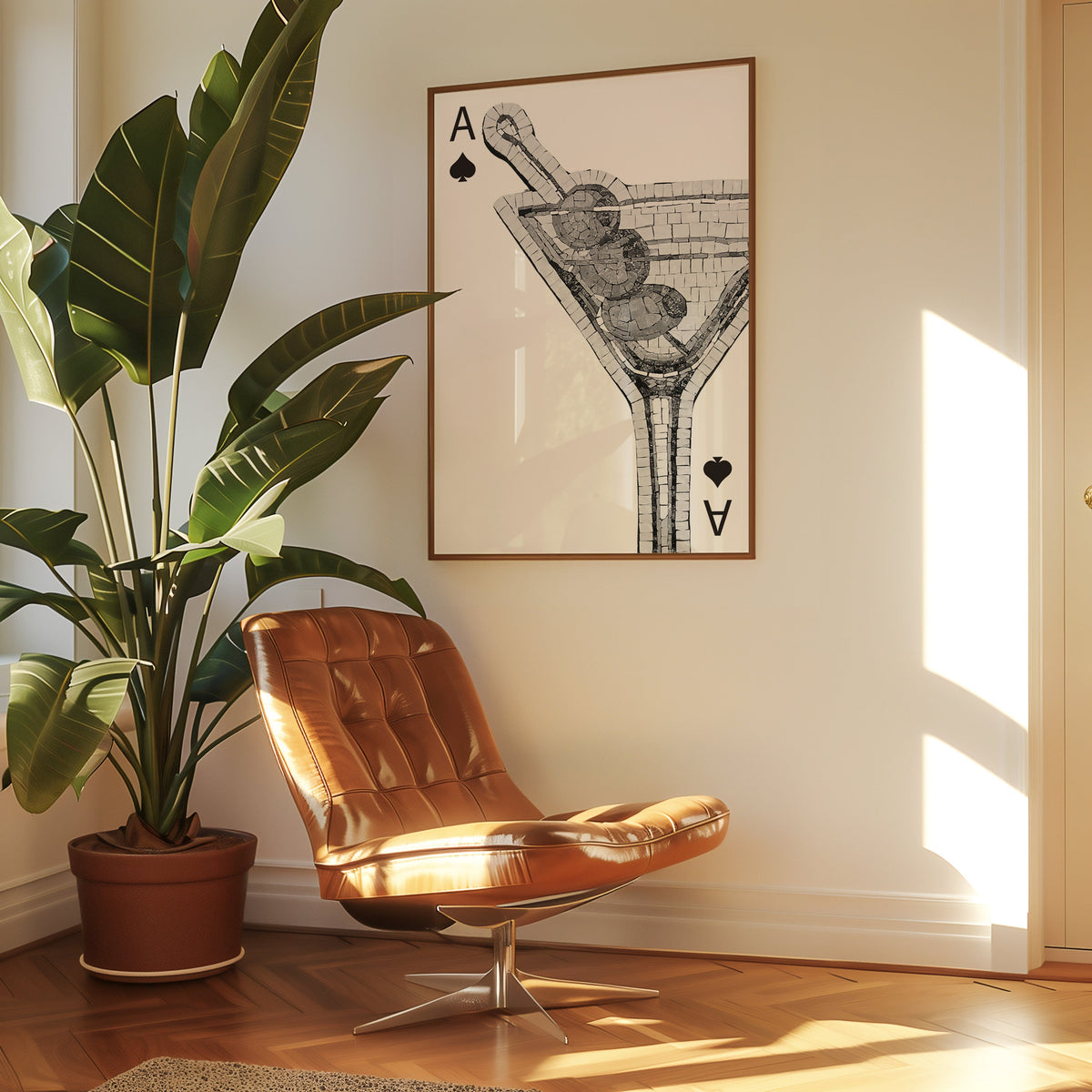 Mosaic martini glass on an ace of spades card print in a walnut frame above a leather lounge chair