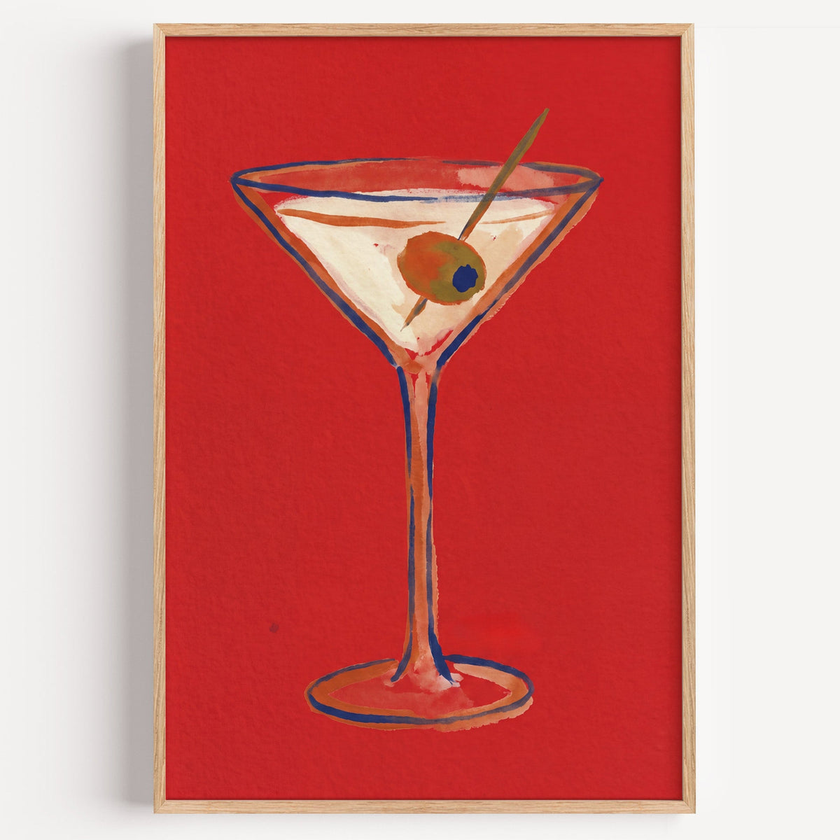 Martini with olive print in a light oak frame on a plain white wall
