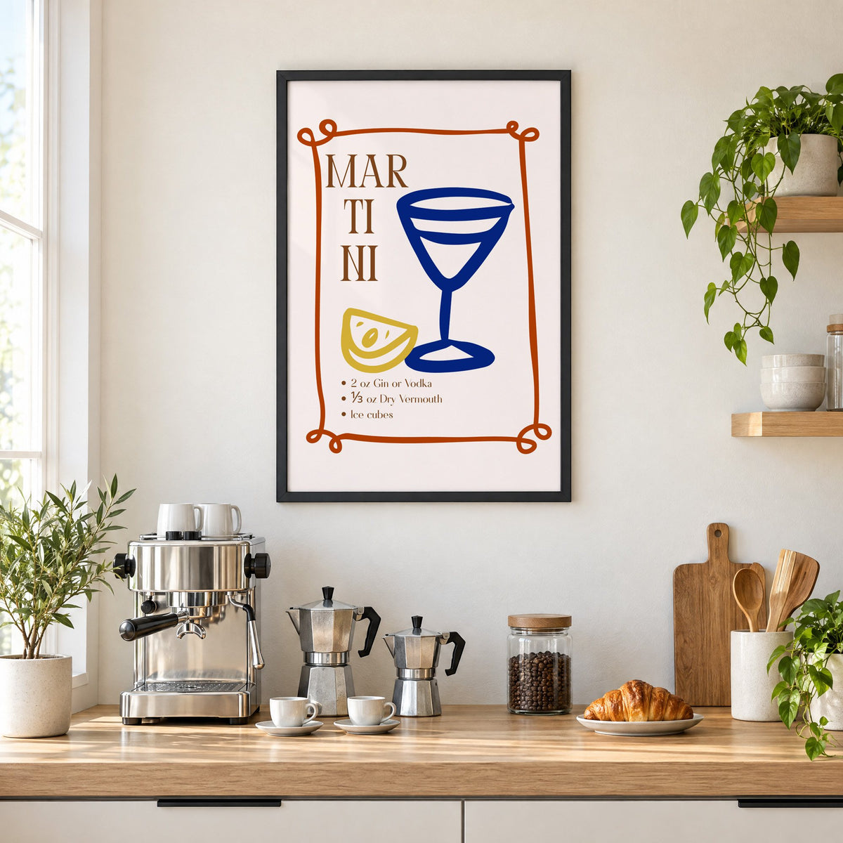 MARTINI recipe navy glass lemon print in a black frame above a home espresso bar with moka pots and espresso cups