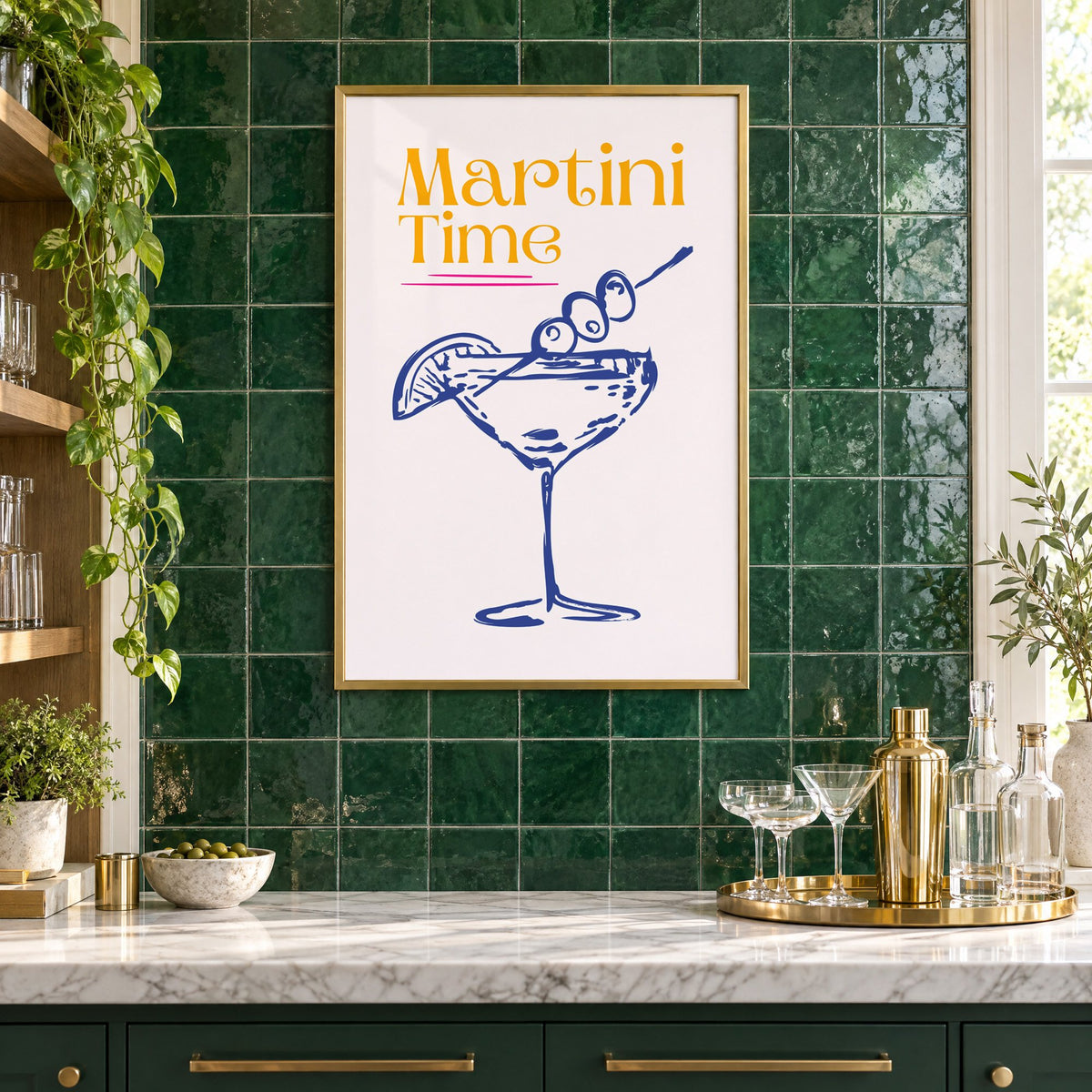 Martini Time blue sketch print in a brass frame on emerald green tiles above a home bar with coupe glasses