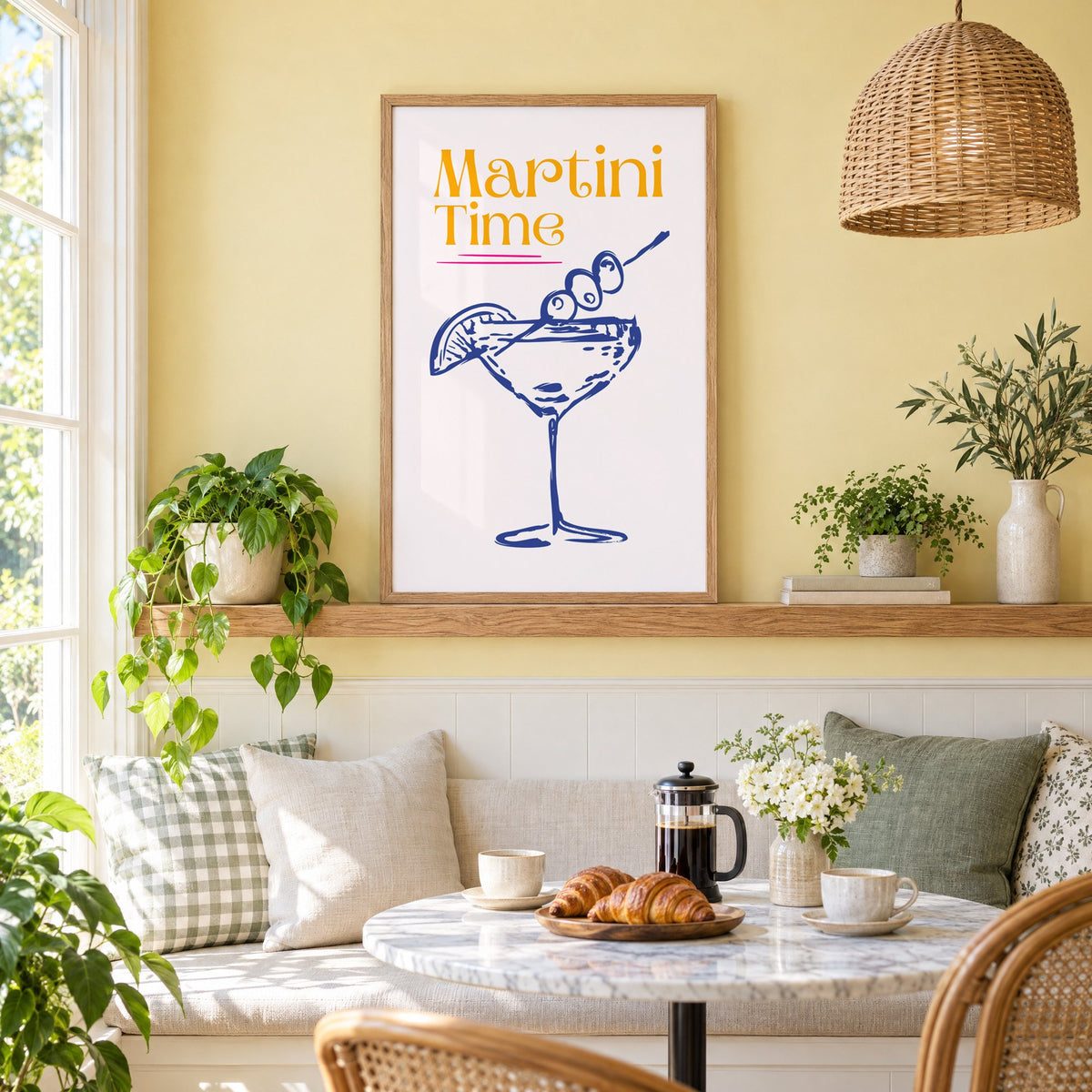 Martini Time blue sketch print in an oak frame on a picture ledge above a sunny breakfast nook