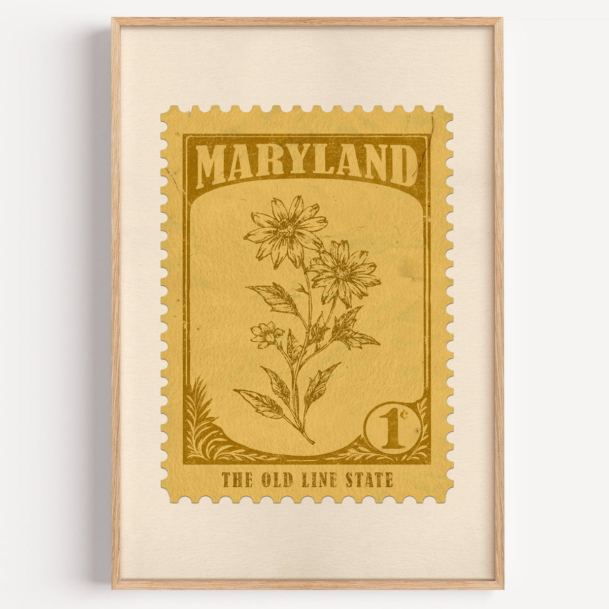 Maryland state flower stamp print in dark gold on honey, light oak frame on a plain white wall
