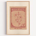 Massachusetts state flower stamp print in dusty rose on blush, light oak frame on a plain white wall