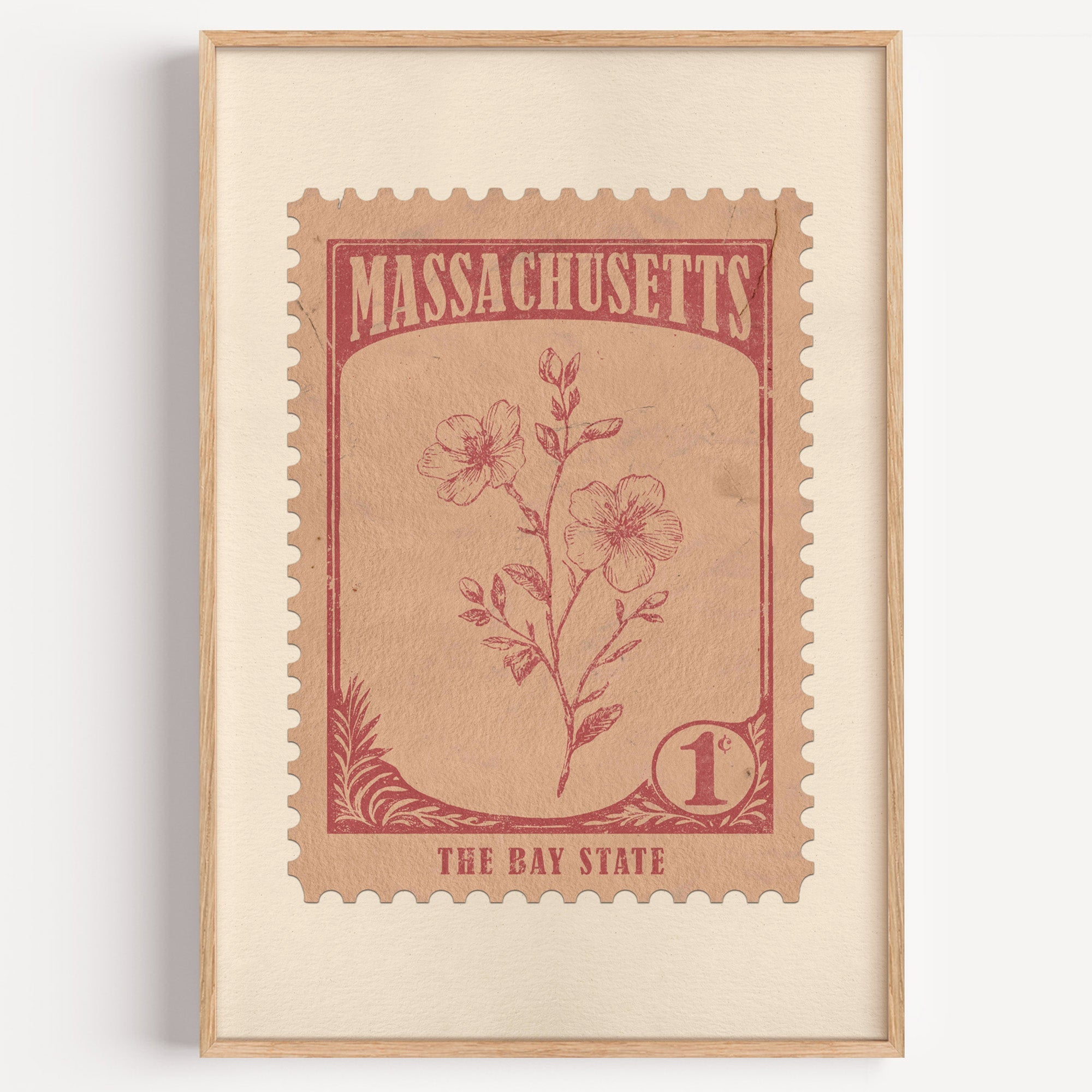 Massachusetts state flower stamp print in dusty rose on blush, light oak frame on a plain white wall