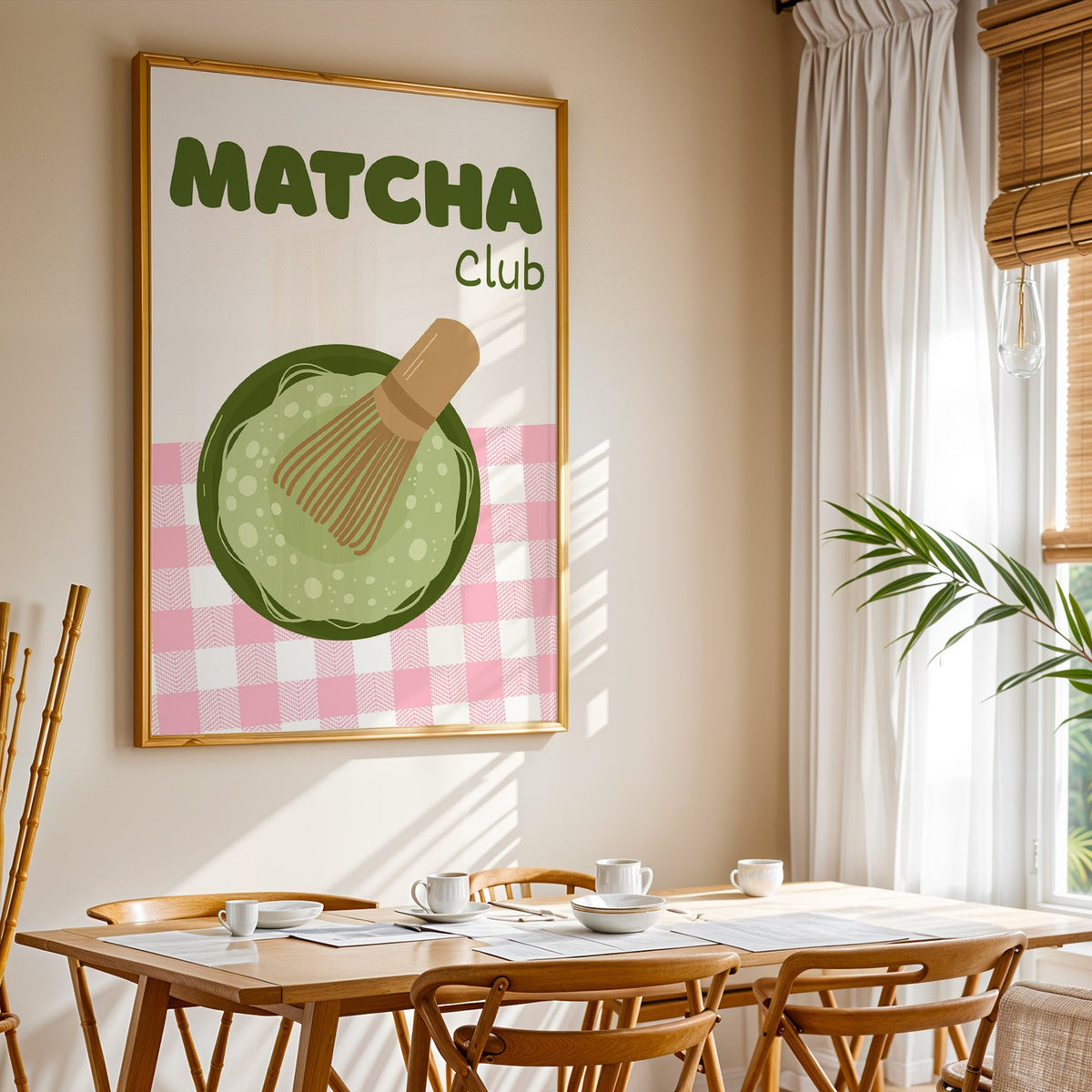 Matcha Club print shown in a gold frame above a breakfast table by a curtained window