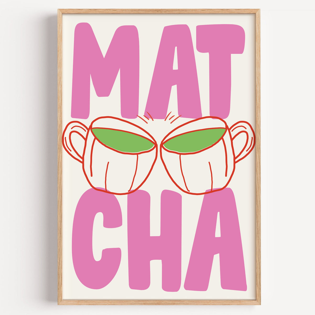 Matcha two cups print in a light oak frame on a plain white wall
