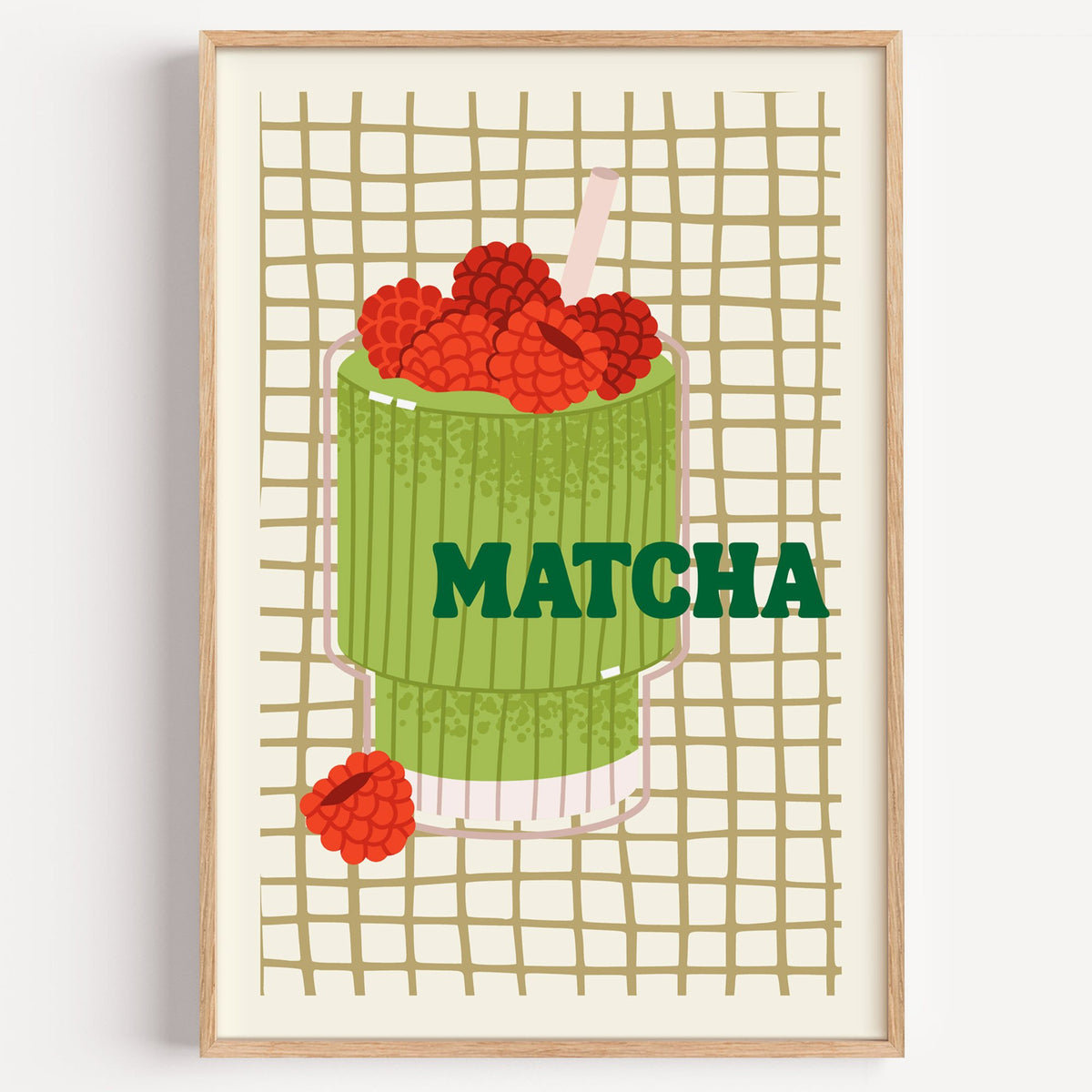 MATCHA raspberry glass on grid print in a light oak frame on a plain white wall