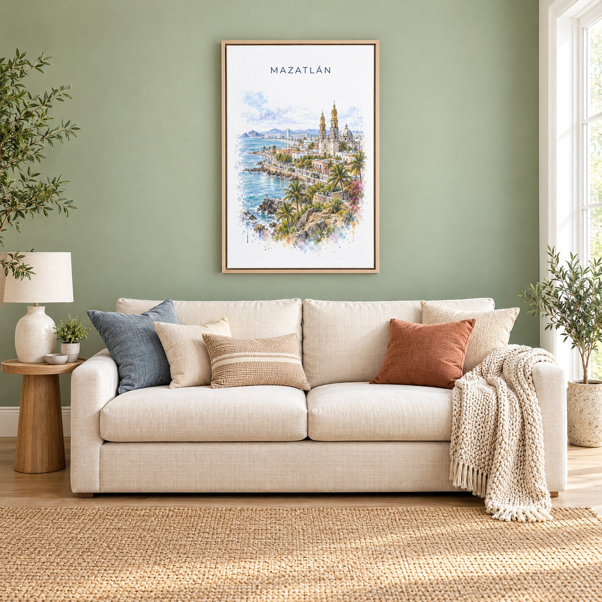 Mazatlan watercolor print as a natural floater canvas above a cream linen sofa on a sage green wall