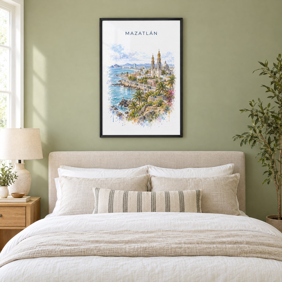 Mazatlan watercolor print in a black frame above an upholstered headboard in a sage green bedroom