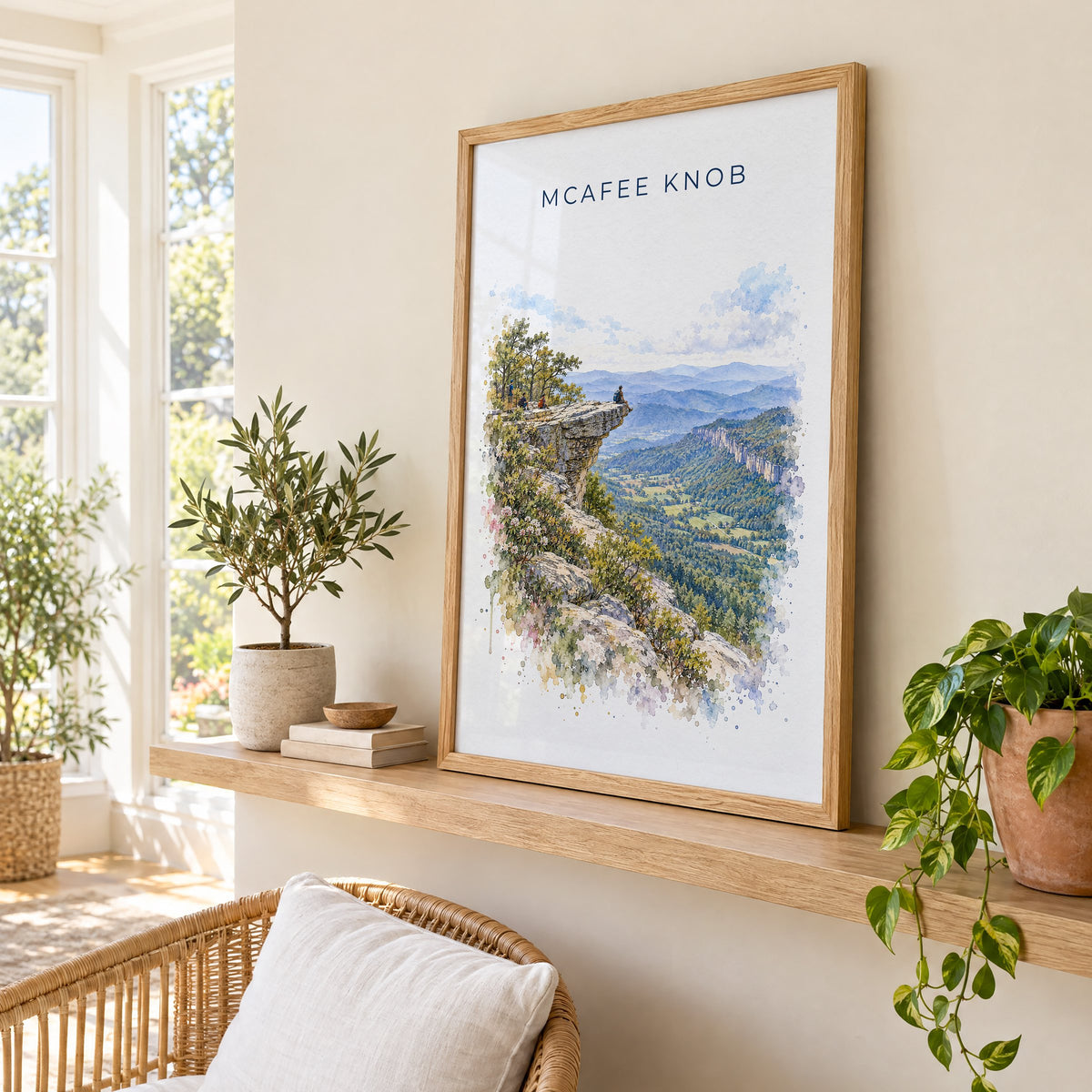 McAfee Knob watercolor print in an oak frame on a picture ledge in a sunlit sunroom