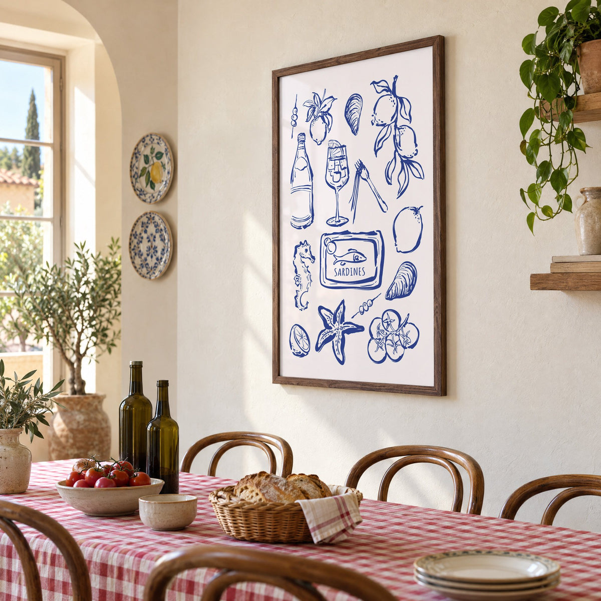 SARDINES tin blue doodle print in a walnut frame above a gingham-covered trattoria table, seen at an angle