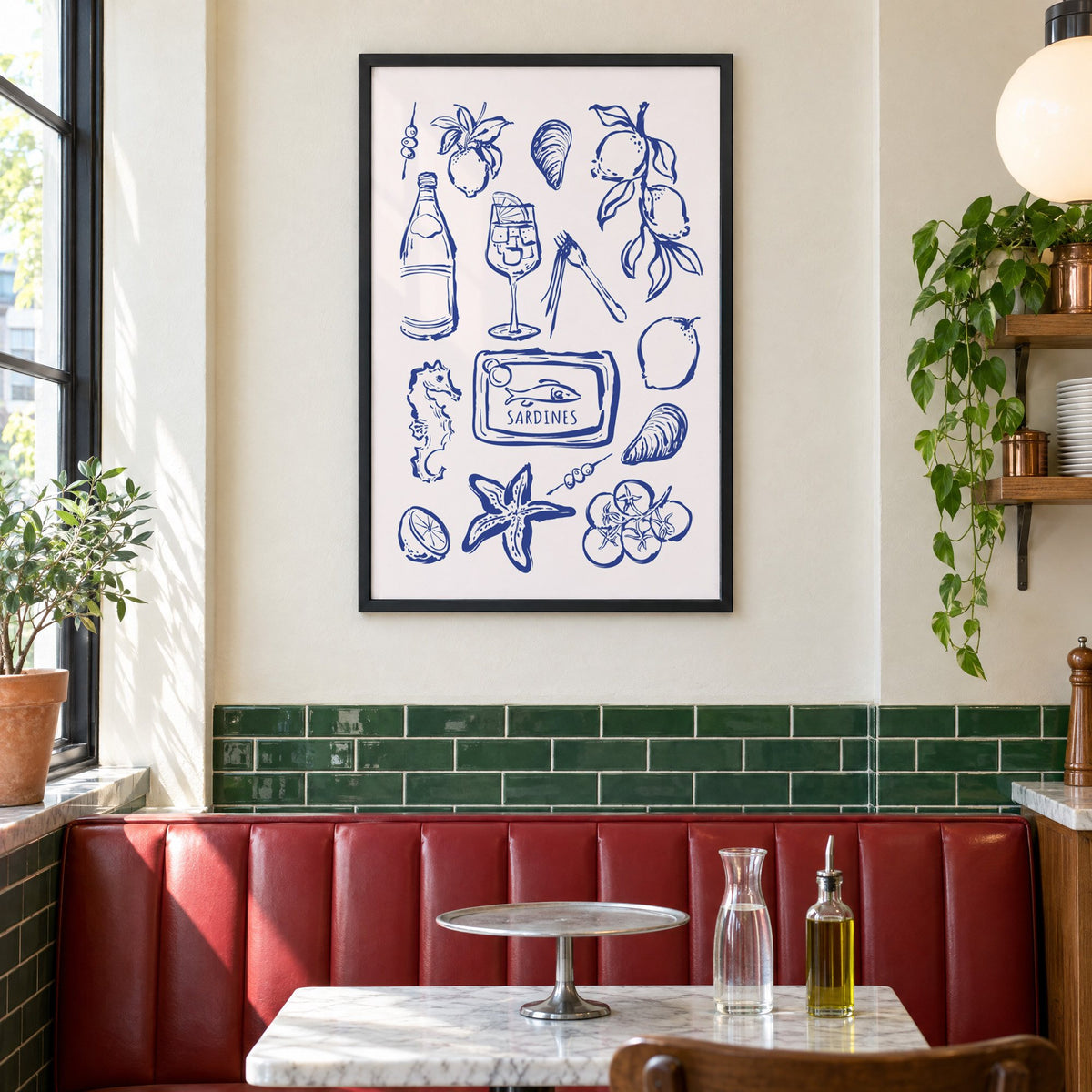 SARDINES tin blue doodle print in a black frame above a red leather booth in a sunny pizzeria