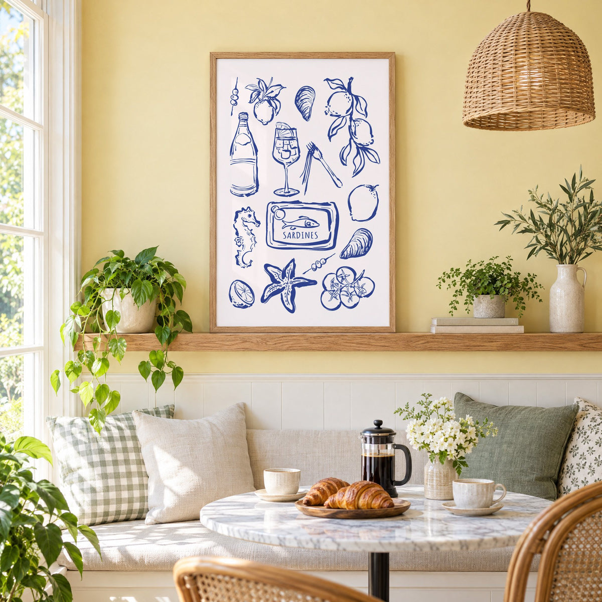 SARDINES tin blue doodle print in an oak frame on a picture ledge above a sunny breakfast nook