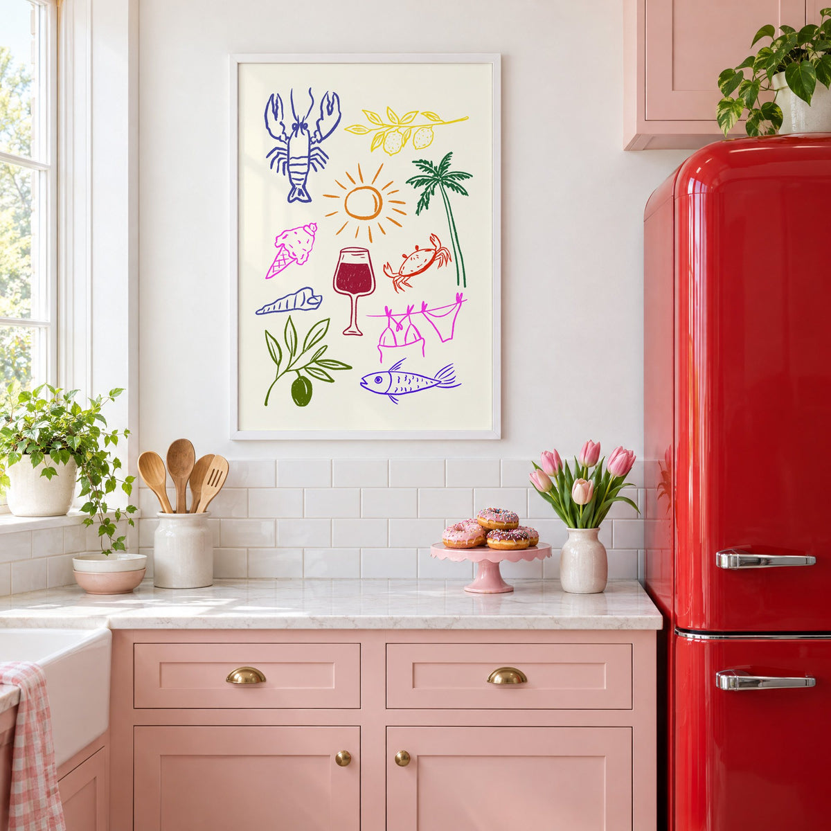 Mediterranean summer doodles lobster and wine print in a white frame above pink cabinets beside a red retro fridge