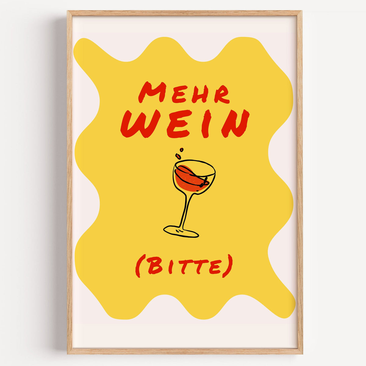 Mehr Wein Bitte yellow print in a light oak frame on a plain white wall