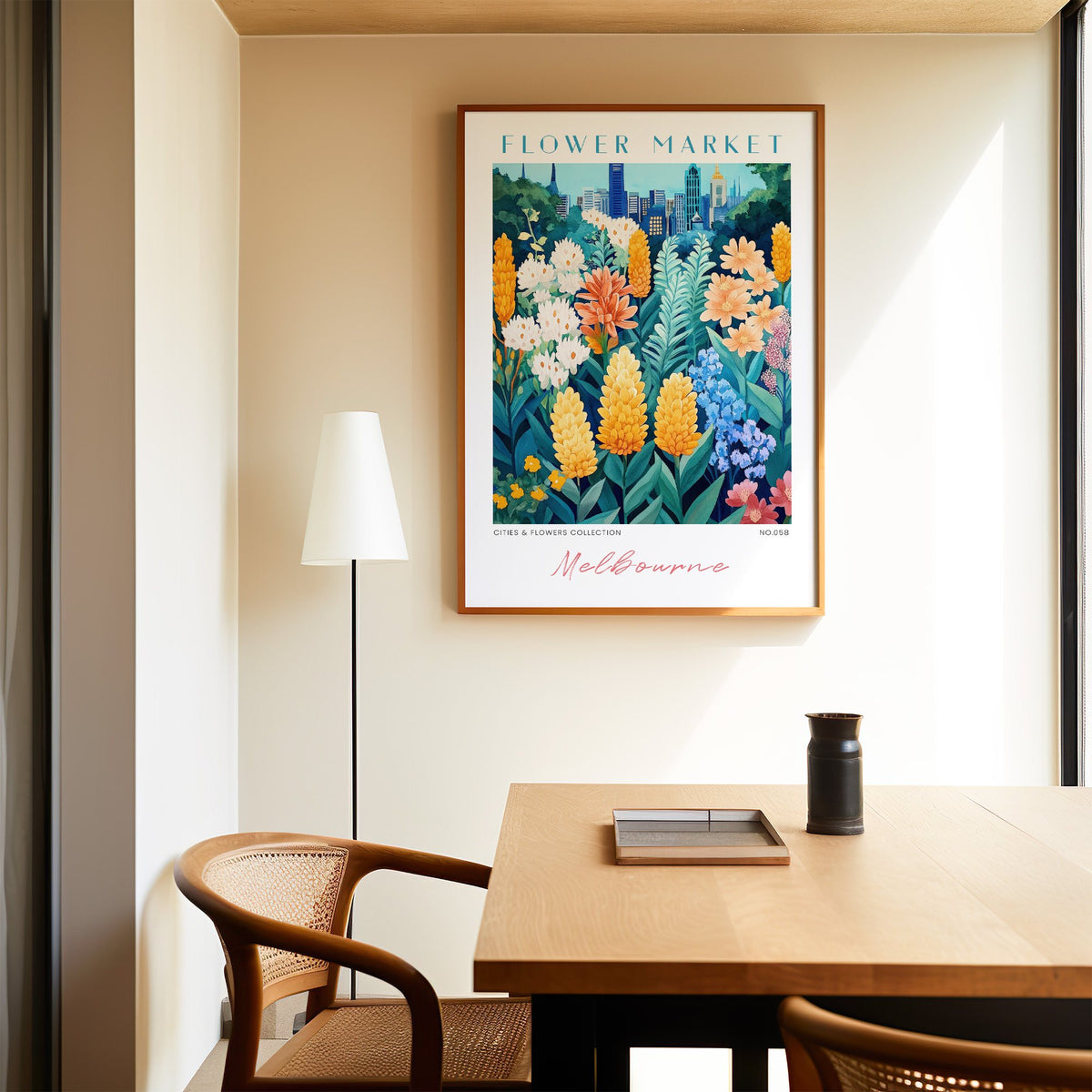 Melbourne flower market print in an oak frame above a dining table and cane chair